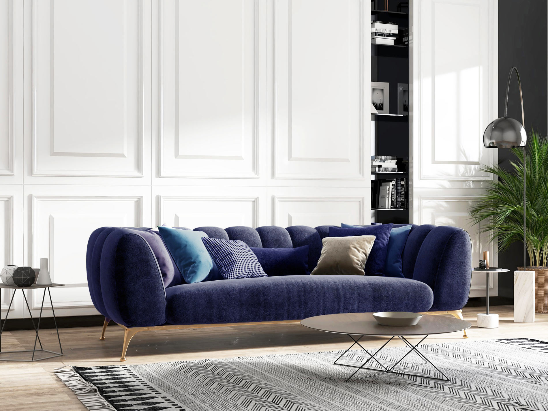 Elegant living room with a navy velvet sofa against white paneled walls