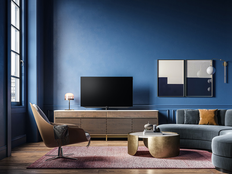 Modern living room with deep blue walls and contemporary furnishings